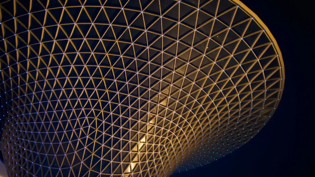 Outsourced cfo headquarters in a mesh style cone-shaped building against a black background.
